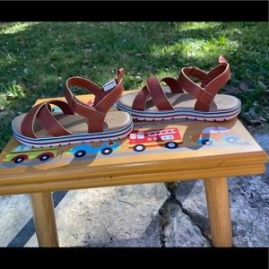 OshKosh B’gosh leather brown sandal in toddler size 11.